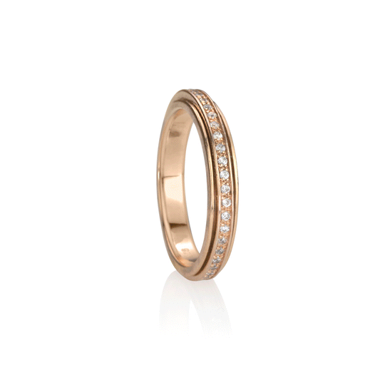 14 KT Rose Gold Vermeil Meditation Ring with spinning band adorned with clear CZ stones, displayed with complimentary MeditationRings Tin and Travel Pouch