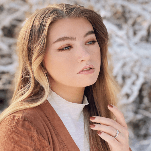 Devotion Meditation Agoda Ring in high-quality sterling silver with oval and marquise spinning band adorned with clear CZ stones, displayed with complimentary tin