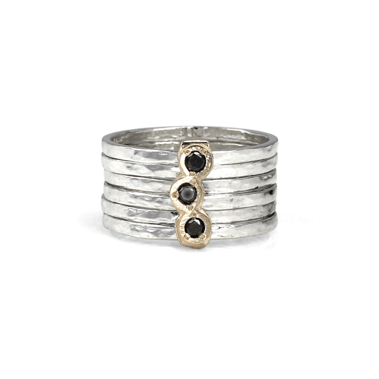Sterling Silver Fidget Ring with Yellow Gold accent bar, Black Diamonds, and Silver hand-hammered spinning bands, displayed with complimentary MeditationRings Tin and Travel Pouch
