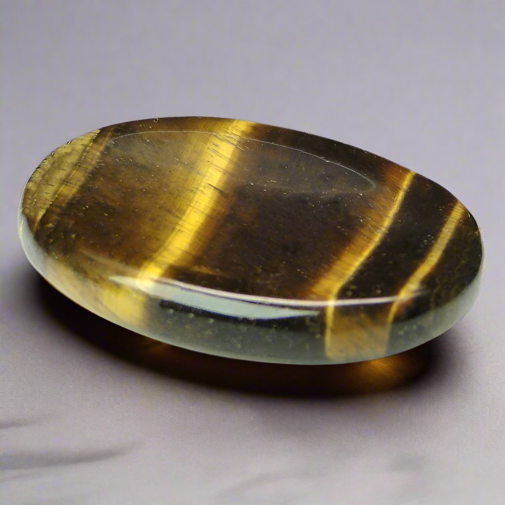 Tiger's Eye Worry Stone for anxiety relief and releasing fear, making it an excellent fidget toy and crystal for anixety.