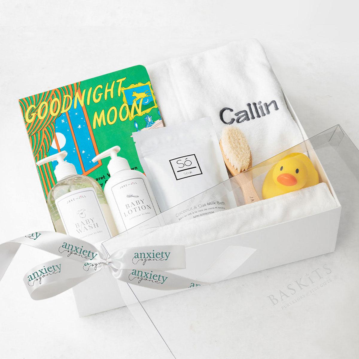 Customizable baby bath gift basket with robe, lotion, book, and brush is a Luxury newborn bath time gift set with personalized robe