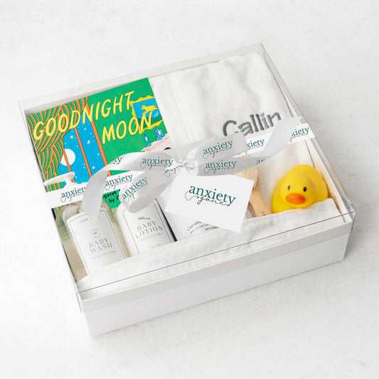 Customizable baby bath gift basket with robe, lotion, book, and brush is a Luxury newborn bath time gift set with personalized robe