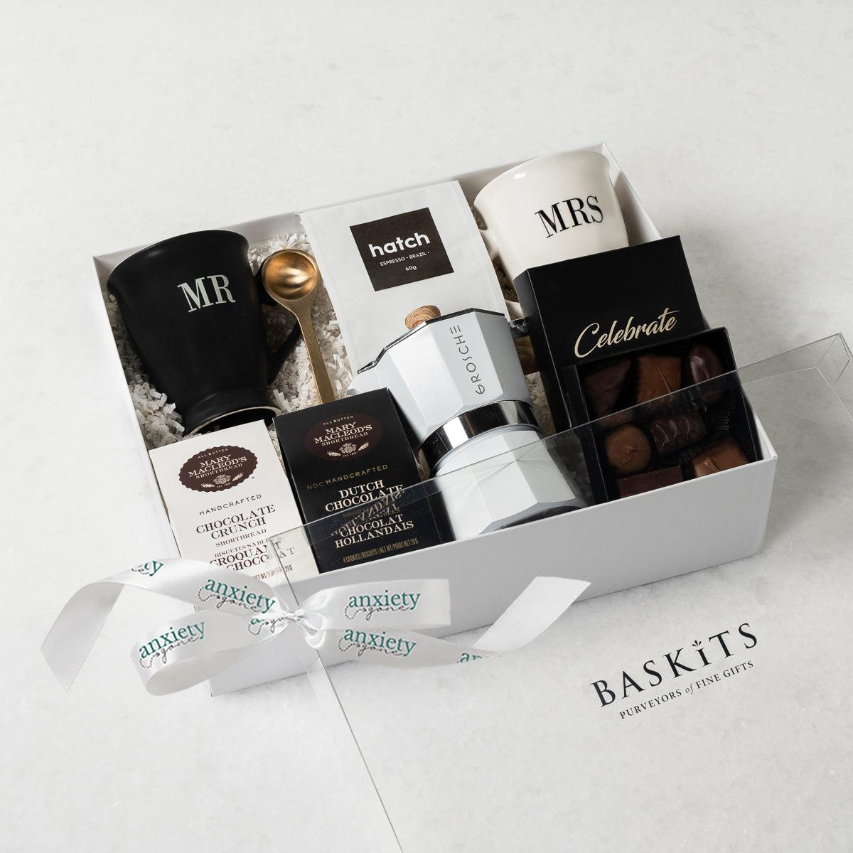Celebrate Love Gift Box featuring self-care items like Mr. &amp; Mrs. mugs, espresso coffee maker, gourmet treats, and more—ideal for engagement gifts, anniversary presents, thank i gift baskets, and self-care gift baskets.