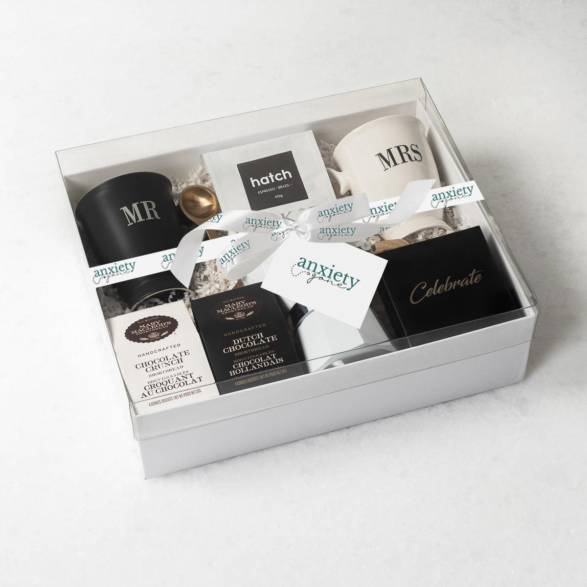Celebrate Love Gift Box featuring self-care items like Mr. &amp; Mrs. mugs, espresso coffee maker, gourmet treats, and more—ideal for engagement gifts, anniversary presents, thank i gift baskets, and self-care gift baskets.