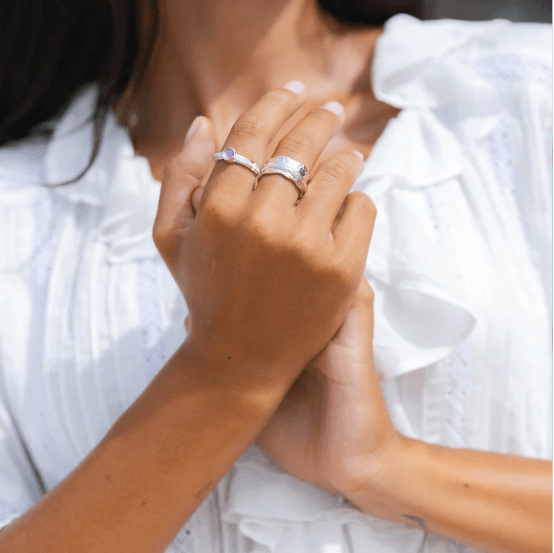 Sterling Silver Agoda Ring with scalloped edges and single spinning band, displayed with complimentary MeditationRings Tin and Travel Pouch