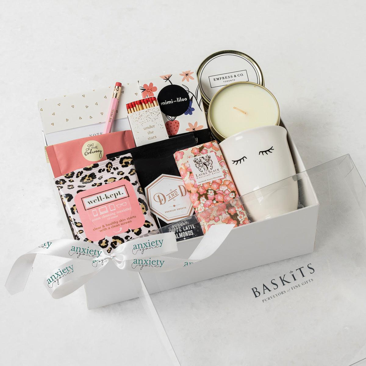 #BOSS Gift Box with luxury self-care items including chocolate, a candle, tea, snacks, and more, elegantly packaged in a keepsake box. Ideal for self-care gifts, thank i gift baskets, get well soon presents, and mental health gifts.