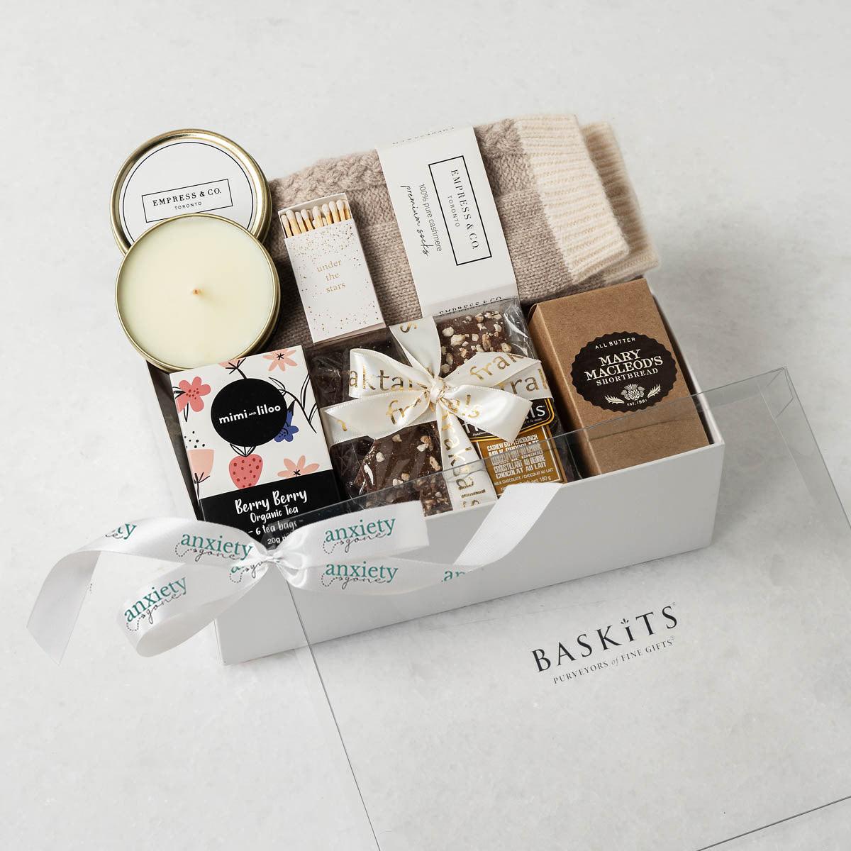 Simply the Best Gift Box featuring luxurious self-care items like milk chocolate, shortbread cookies, a scented candle, cashmere socks, and more—ideal for self-care gifts, thank i gift baskets, and mental health gifts.