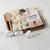Spa Essentials Wellbeing Gift Box featuring luxurious self-care items like lavender bath bombs, face masks, foot care products, and a wooden tray—perfect for self-care gifts, spa gift baskets, and mental health gifts.
