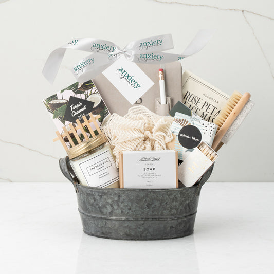 Spa Day Gift Basket – A luxurious self-care gift box featuring a candle, face mask, tea, chocolate, and more for the ultimate pampering experience.