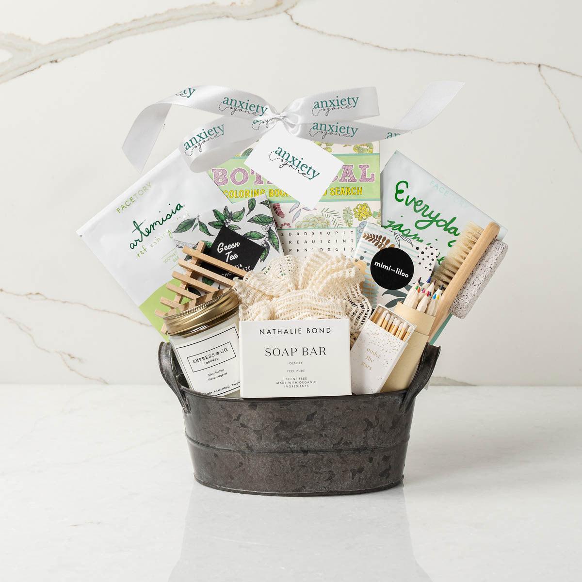 Spa Day Gift Basket featuring luxurious self-care items like a candle, face mask, foot brush, tea, and chocolate—perfect for self-care gifts, thank i gift baskets, and wellness gift baskets.
