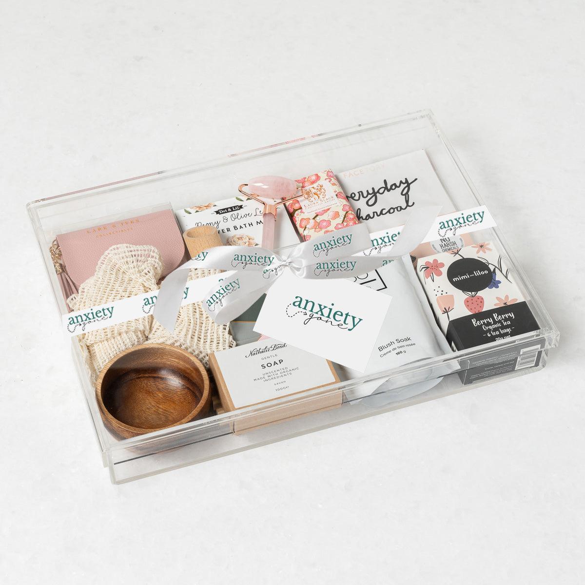 Luxe Serenity Gift Box featuring premium self-care items, bath milk, jade roller, tea, chocolate, and more—perfect for self-care gifts, get well soon gifts, and thank i gift baskets.