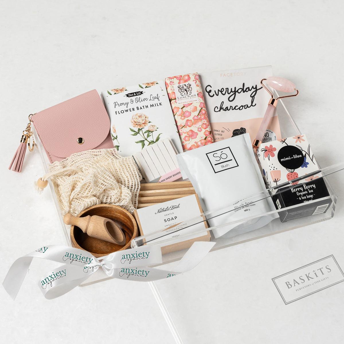 Luxe Serenity Gift Box featuring premium self-care items, bath milk, jade roller, tea, chocolate, and more—perfect for self-care gifts, get well soon gifts, and thank i gift baskets.