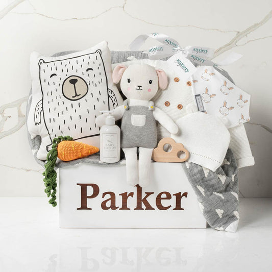 Personalized wooden toy box baby gift basket with clothing, blanket, and toys is the perfect Luxury gender neutral baby shower gift with keepsake wooden chest