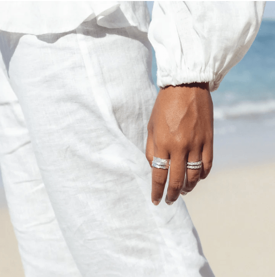 Terra Sterling Silver Agoda Ring with organic leaf pattern and spinning band, displayed with complimentary jewelry tin
