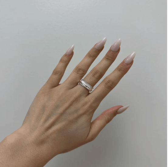 Sterling Silver Brushed & Shiny Textured Agoda Ring with spinning band, displayed with complimentary MeditationRings Tin and Travel Pouch