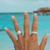 Sterling Silver Free-Floating Agoda Ring with white enamel spinning bands and CZ accent bar, displayed with complimentary MeditationRings Tin and Travel Pouch