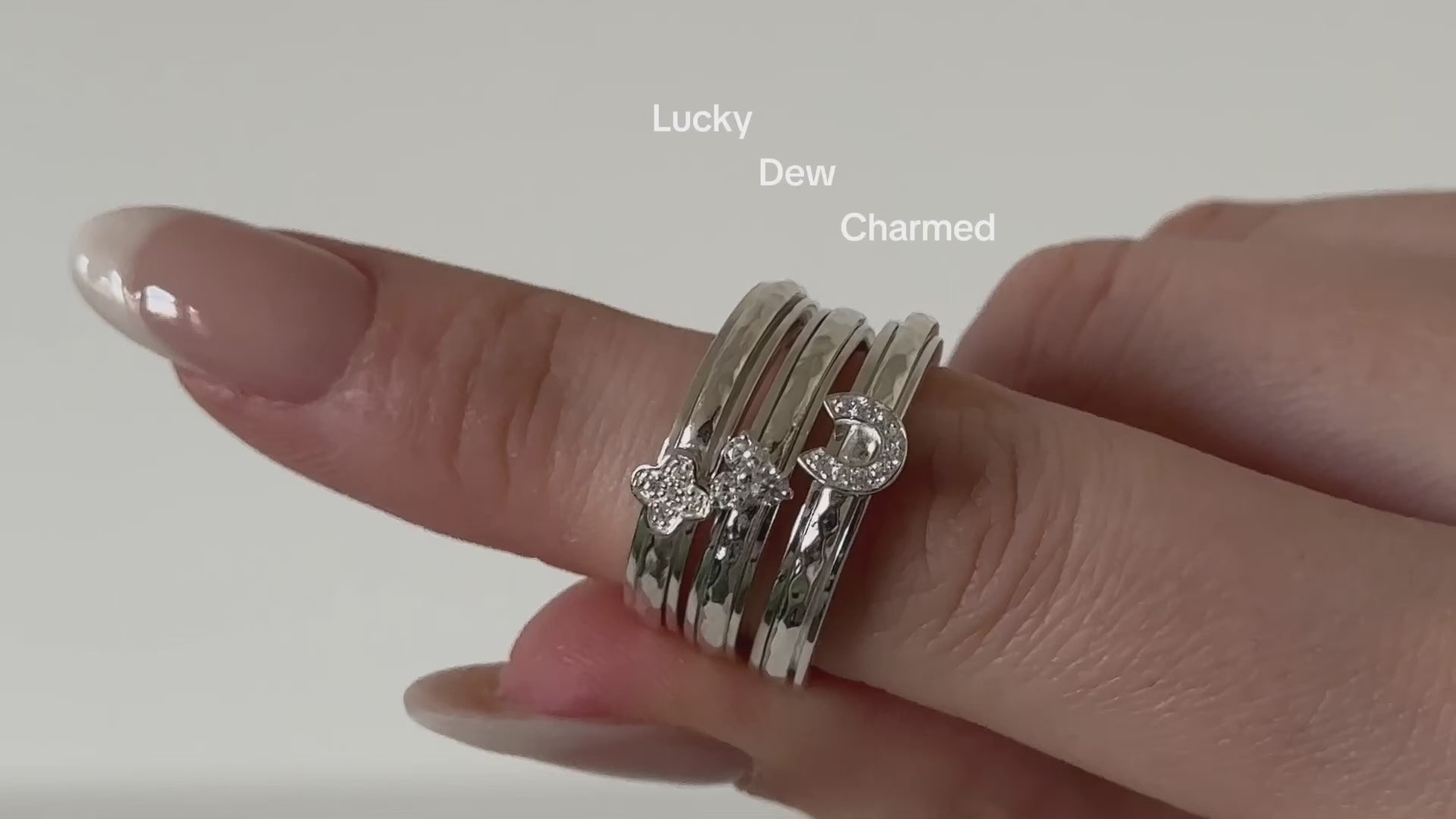 Sterling Silver Fidget Ring with lucky clover and hammered spinning band and CZ Clover element.