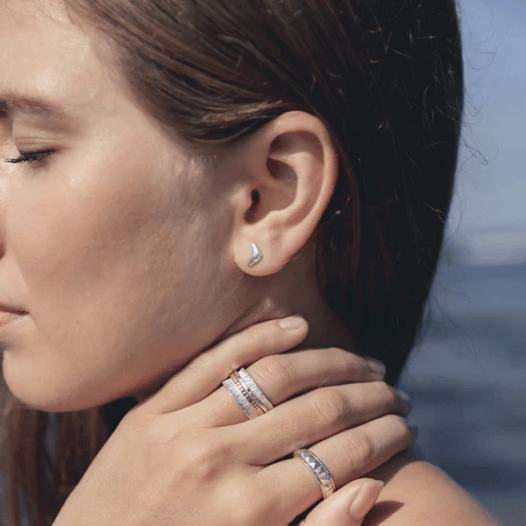 Spinning anxiety ring in quality silver with retro square pattern, displayed with complimentary tin and travel pouch