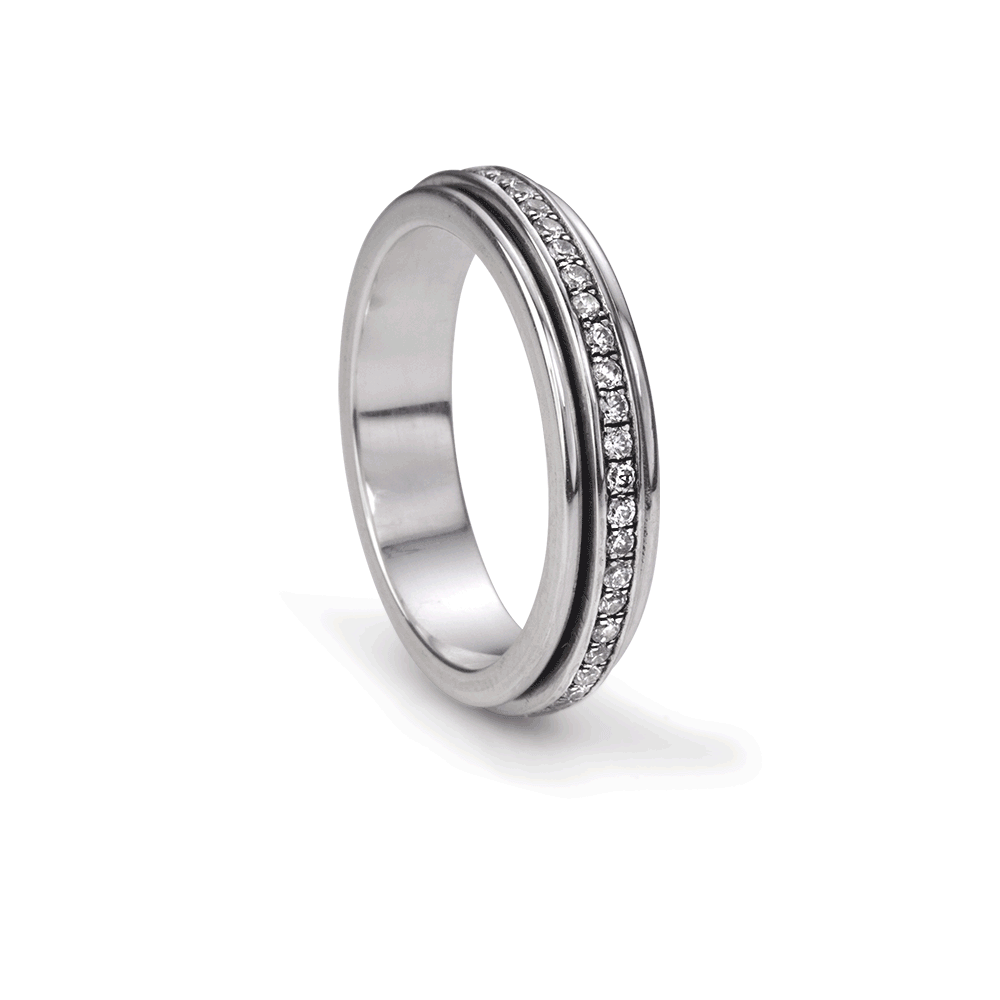 Lunar Sterling Silver Agoda Spinning Ring with clear cubic zirconia and meditation spinning band, displayed with complimentary MeditationRings Tin