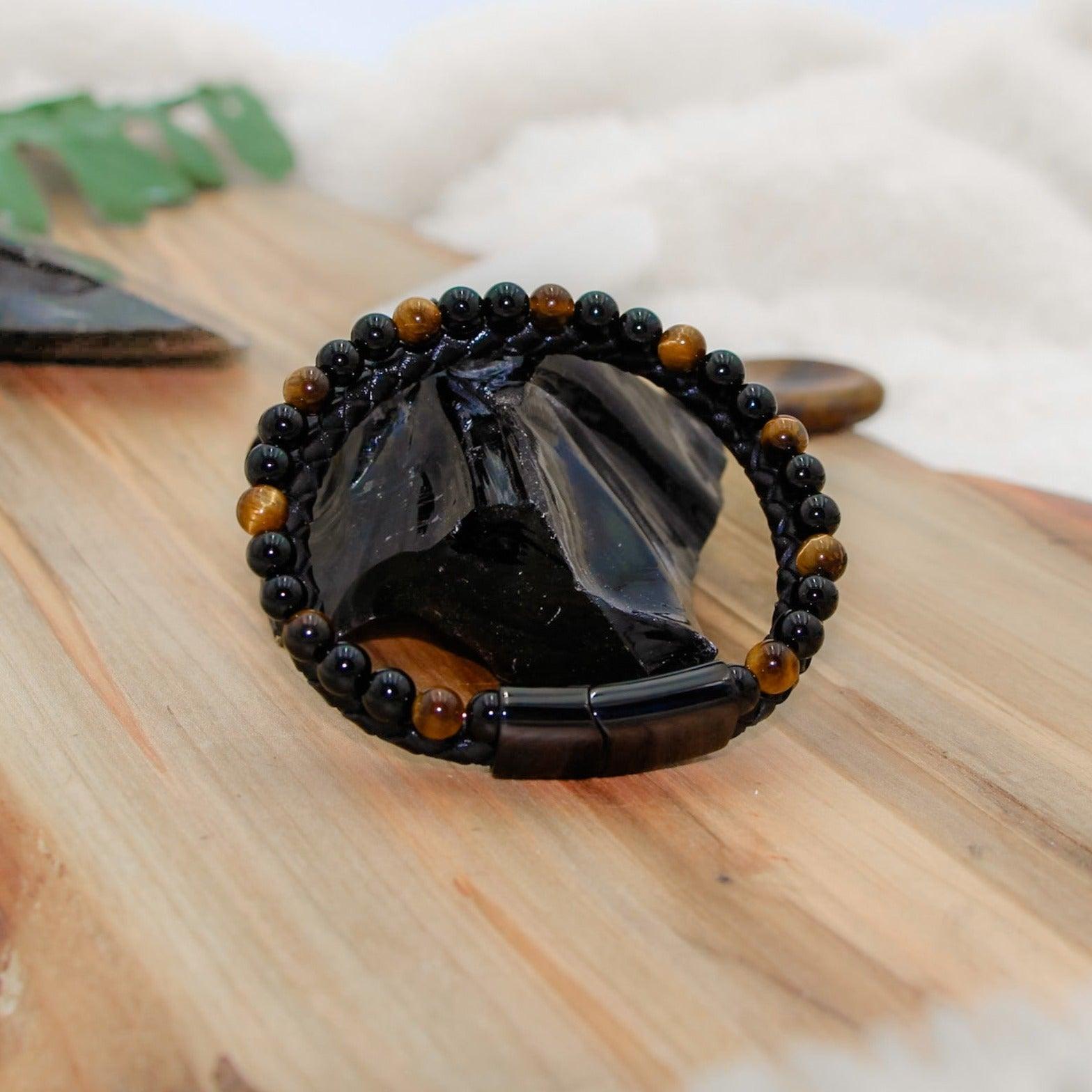 Tiger's Eye Leather Bracelet with braided black leather for mental clarity and emotional strength.