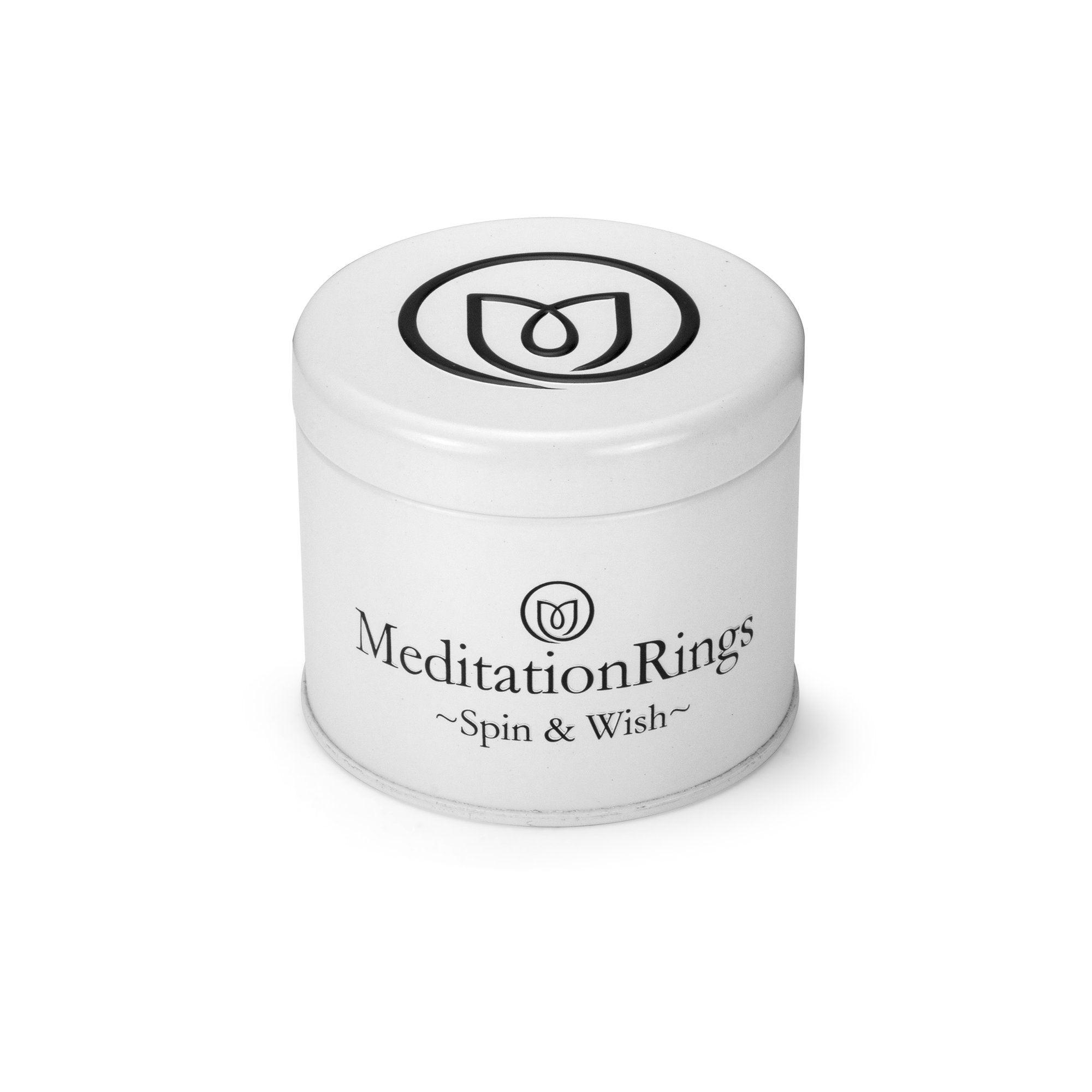 Lunar Sterling Silver Agoda Spinning Ring with clear cubic zirconia and meditation spinning band, displayed with complimentary MeditationRings Tin
