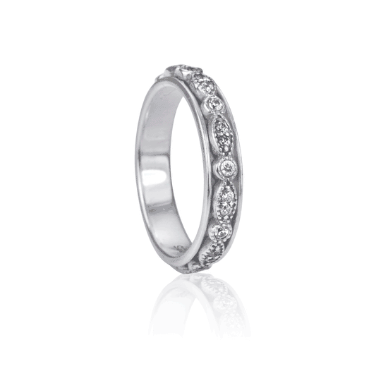 Devotion Meditation Agoda Ring in high-quality sterling silver with oval and marquise spinning band adorned with clear CZ stones, displayed with complimentary tin